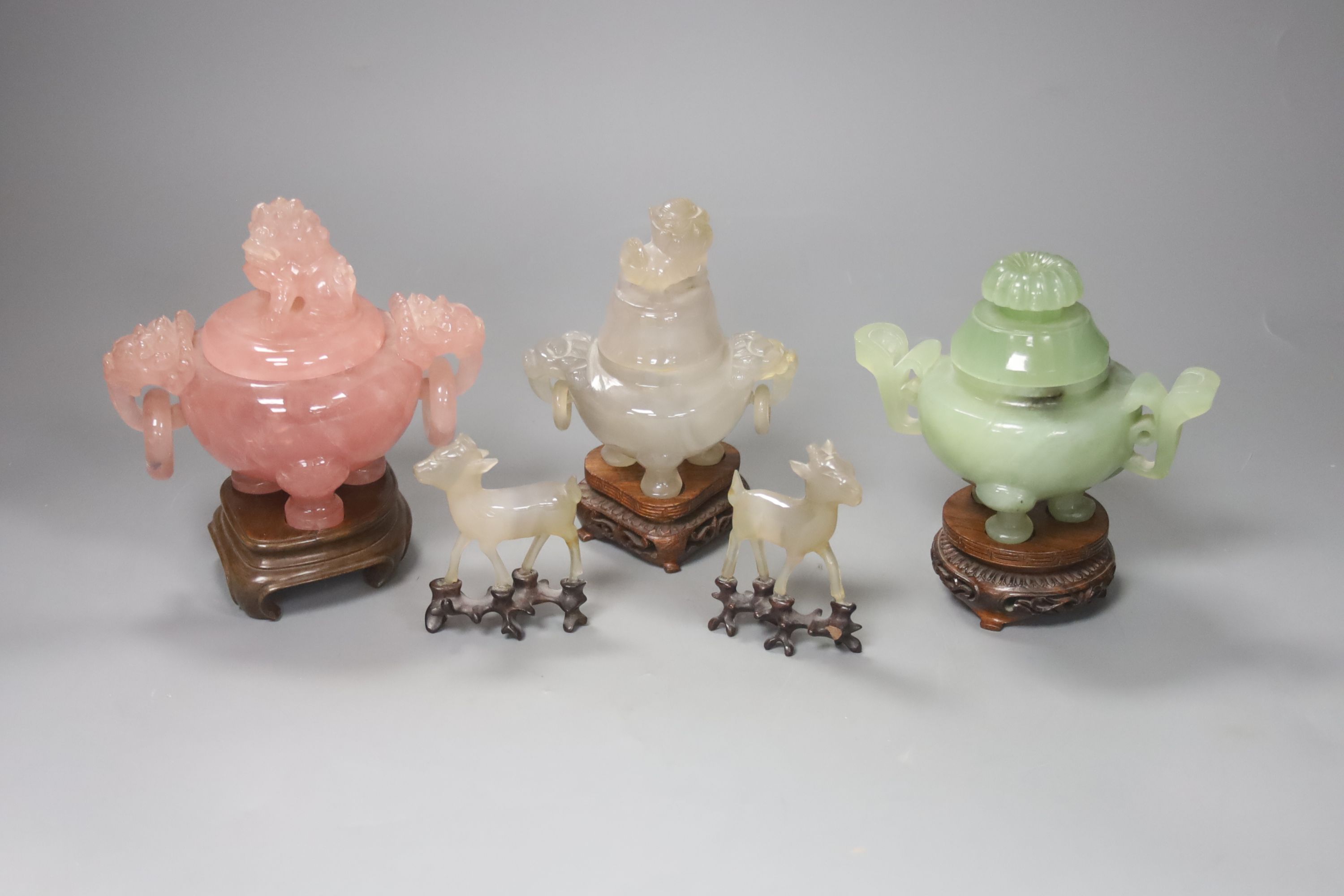 A Chinese rose quartz censer and cover on stand and four other items, including two further hardstone censers and covers and two small models of deer (5)